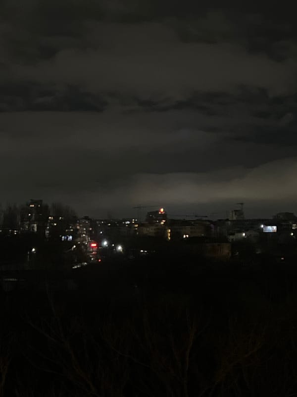 Sofia cityscape illuminated under cloudy night sky
