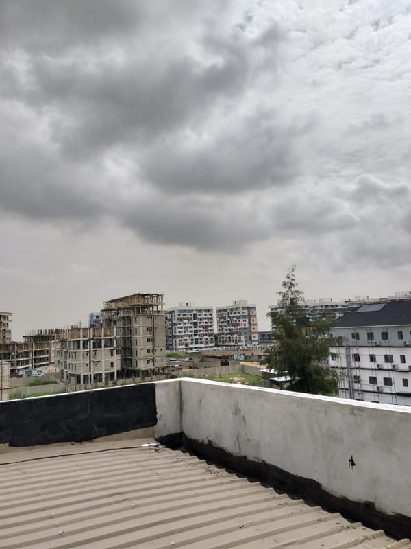 Morning rooftop views document everyday Moba, Nigeria street scenes