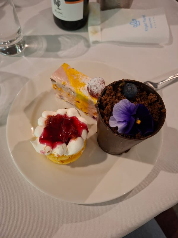 Three desserts plated at dining establishment in Pavel Banya