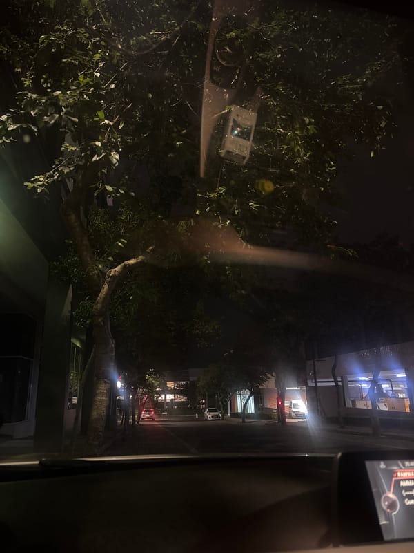 Nighttime street view captured from window in Umhlanga Rocks