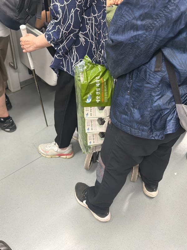 Morning commuters travel by train in Seoul