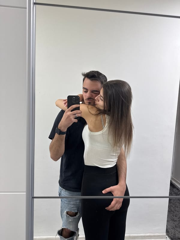 Couple takes playful mirror selfie in Sofia
