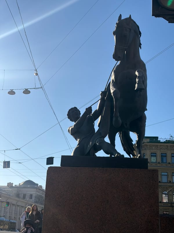 Tourists and locals explore central Saint Petersburg landmarks afternoon