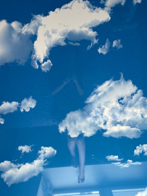 Surreal indoor scene with person on textured surface observed