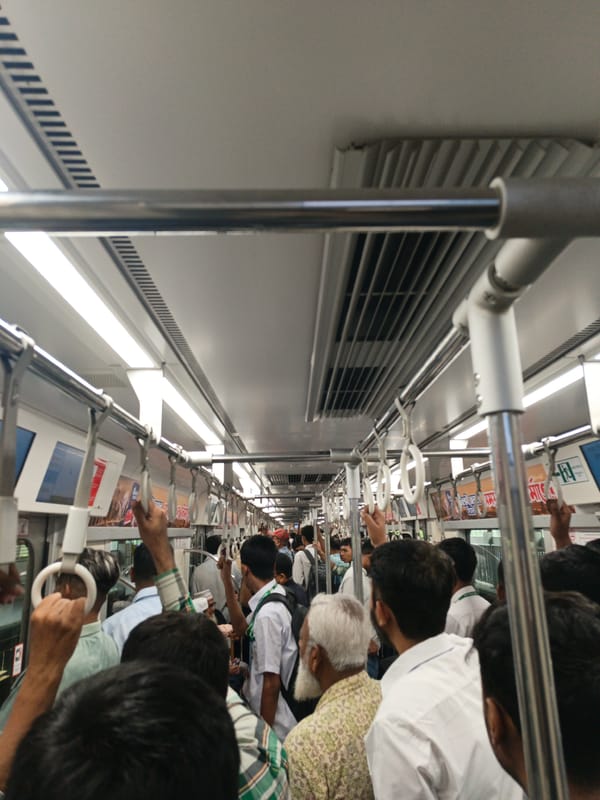 Morning rush hour crowds pack Dhaka metro train