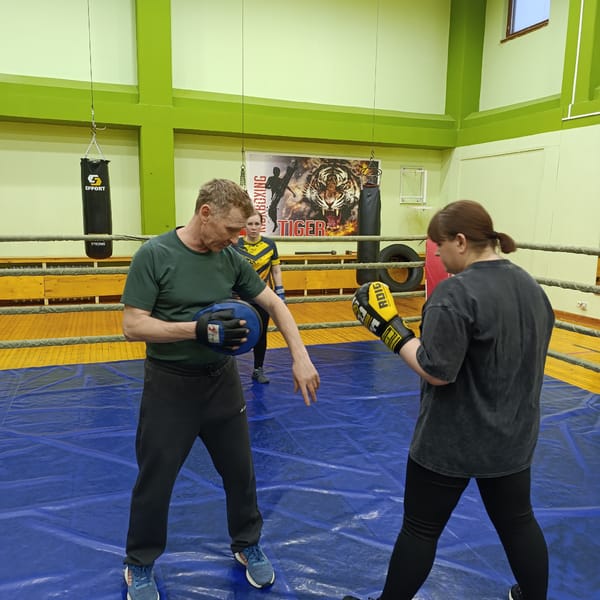 Boxing and martial arts training session observed at gym