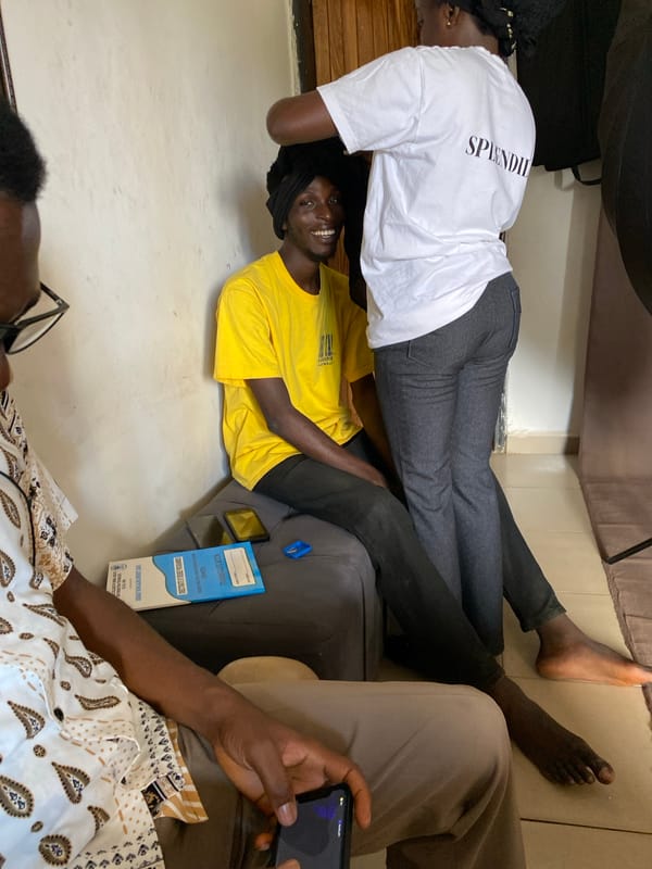 Friends help tie headscarf in casual Jos gathering