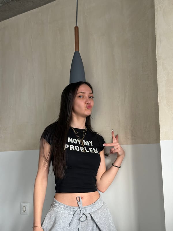 Woman poses in statement shirt across Yerevan, Armenia