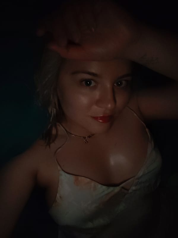 Woman photographed in dimly lit setting in Izhevsk