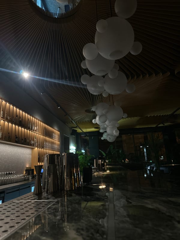 Evening dining scene captured at Varna restaurant with distinctive ceiling