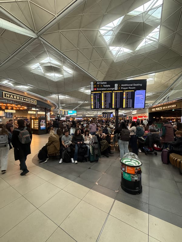 Crowded airport waiting area observed in Uttlesford, UK