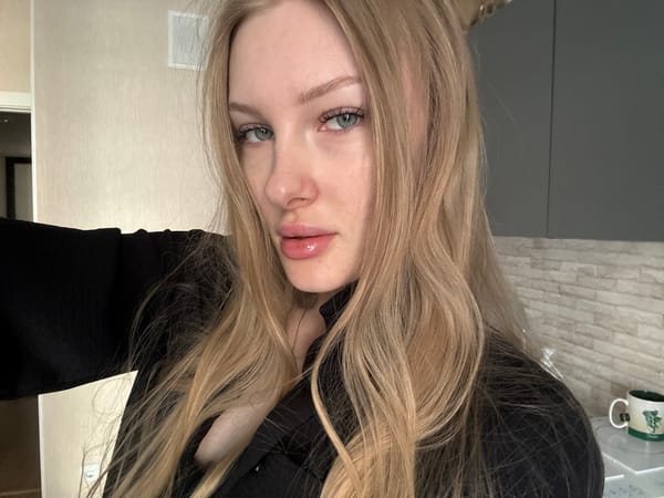 Woman takes afternoon selfie session in Perm apartment