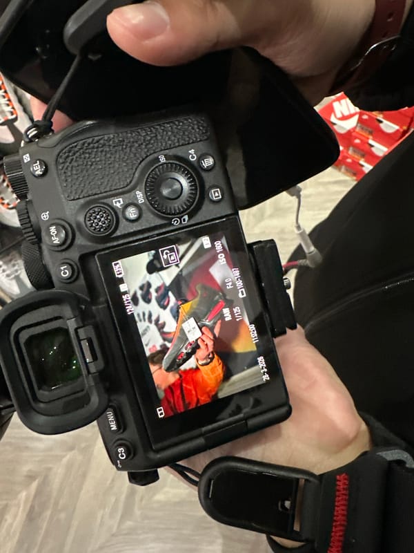 Person holds Sony camera with active LCD screen in Liverpool