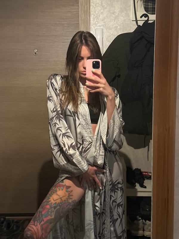Mirror selfie in a patterned robe, Moscow apartment hallway