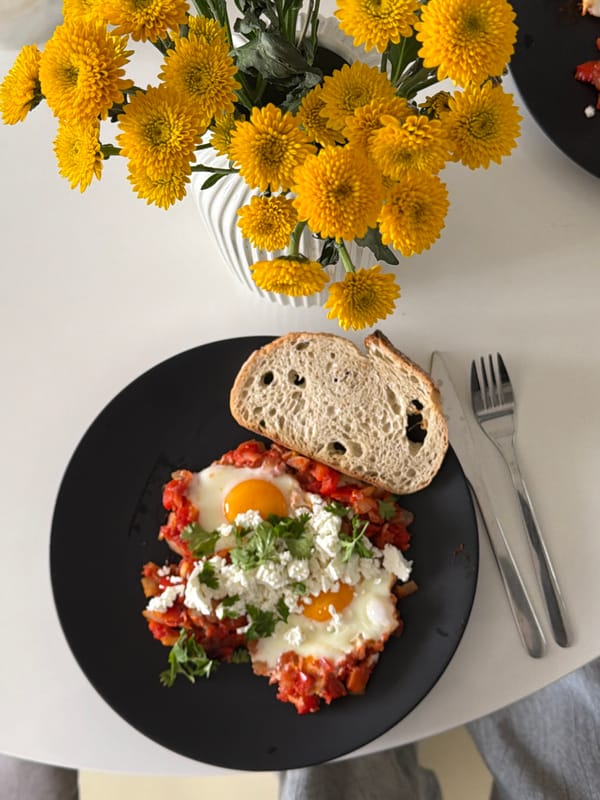 Morning domestic moments: shakshuka breakfast and baby with dog