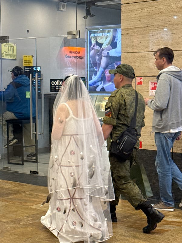 Wedding dress and military uniform spotted in Khimki commercial area