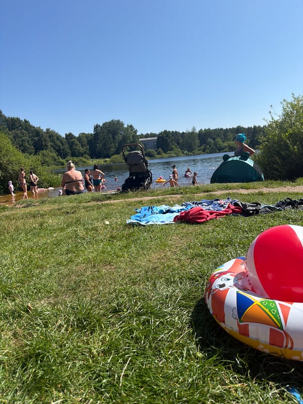 Sunny lakeside hangout in Riga with toys and swimmers
