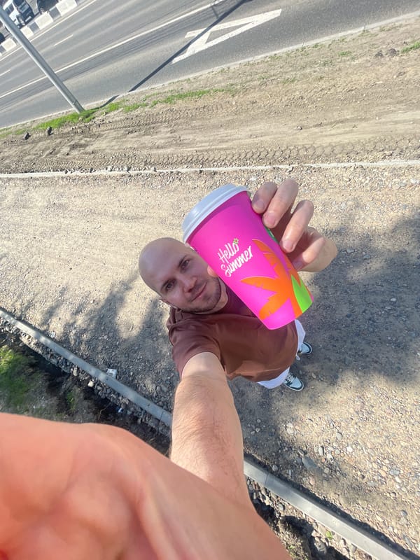 Man takes selfie with pink cup in Krasnoyarsk