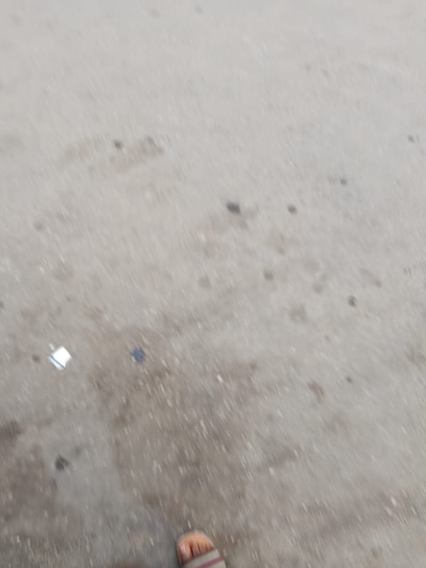 Street life and commerce along a Jos, Nigeria thoroughfare