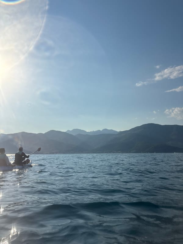 Kayaking on the Bay of Kotor under bright Montenegrin sun