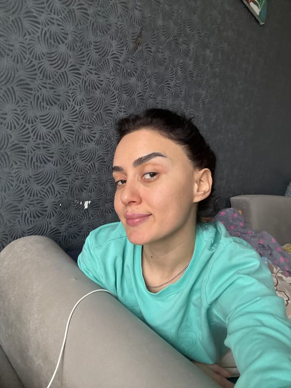 Woman takes casual indoor selfies in Tbilisi apartment