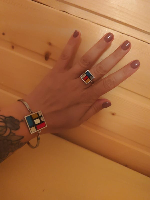 Woman photographs herself and jewelry in Russian village