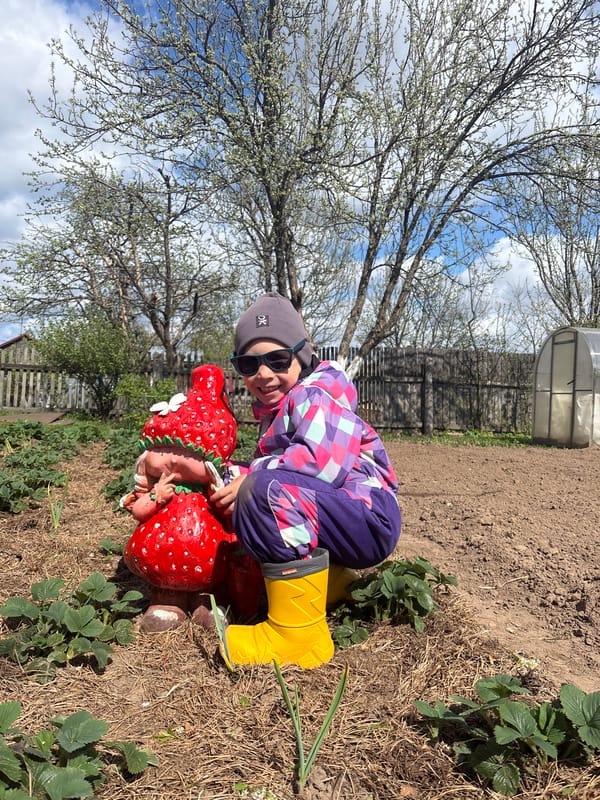 Child explores rural Russian farm property with bees, chickens