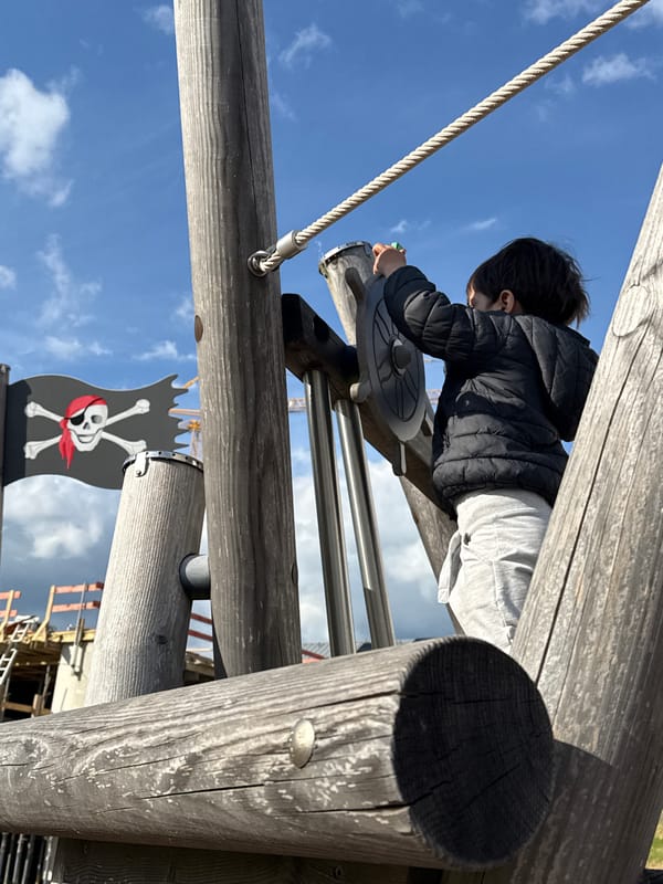 Child plays on pirate playground in Junglinster, Luxembourg