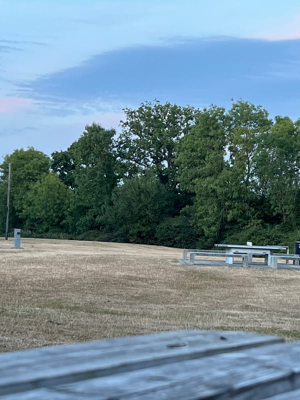 Evening pit stop at a Guildford picnic table with an e-bike