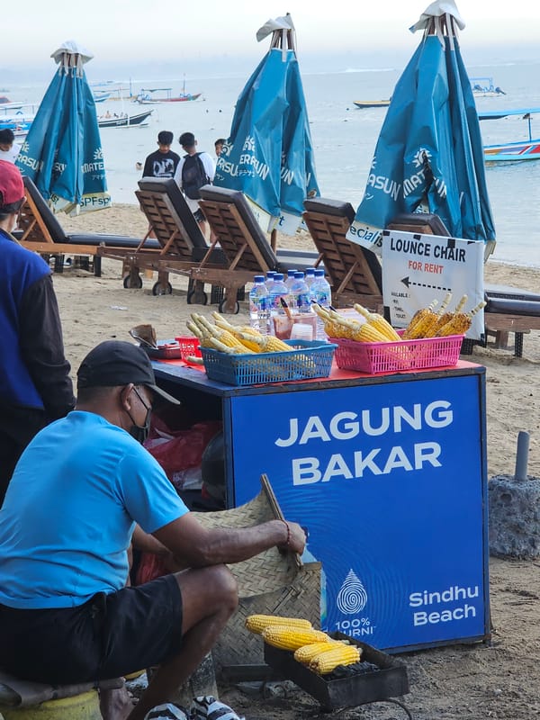 Busy afternoon at Sindhu Beach with vendors and beachgoers