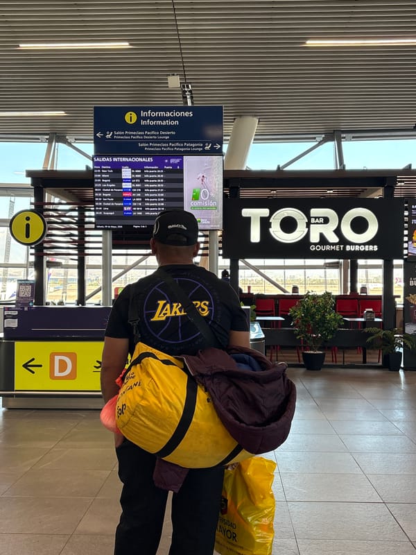 Evening travelers navigate Santiago airport terminals and retail areas