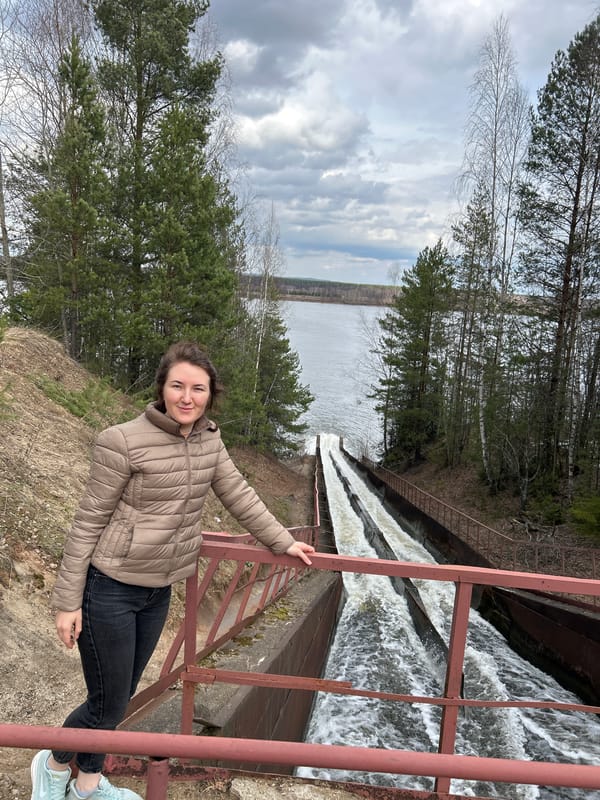 Woman photographed at waterfall overlook in Chernushka, Russia