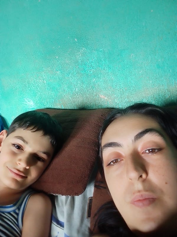 Mother and child captured in quiet bedroom moment
