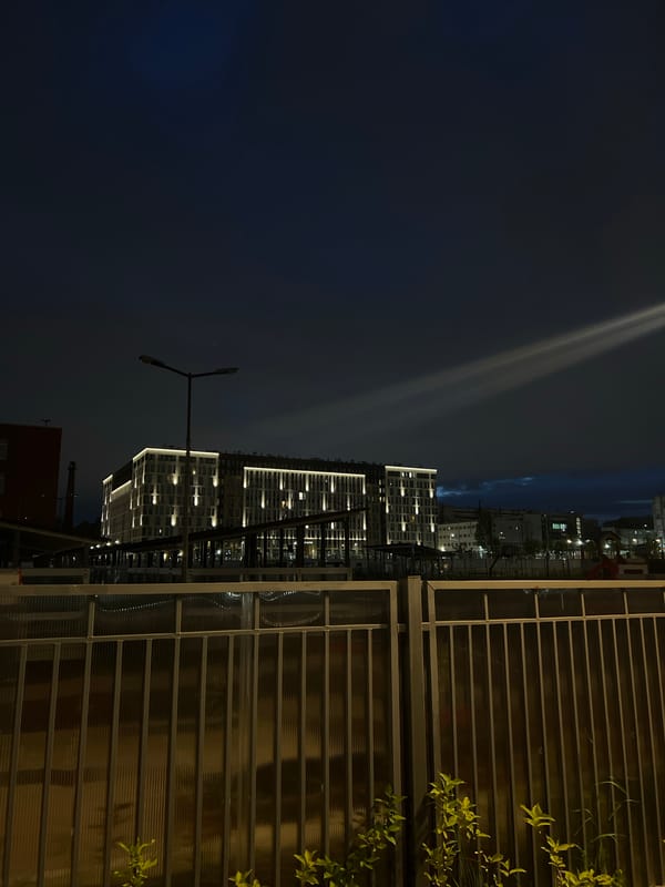 Modern illuminated building observed at night in Russian urban area