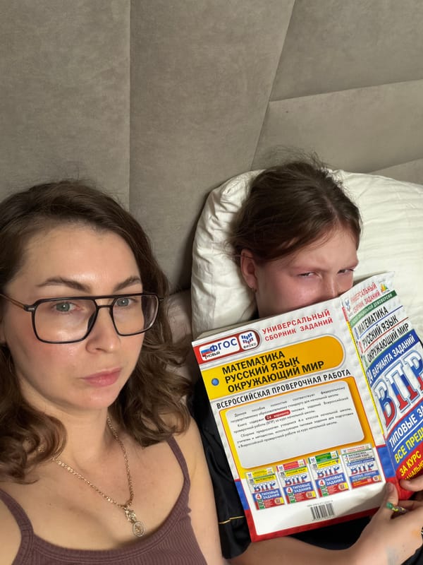 Two women photographed resting indoors in Markovo, Russia