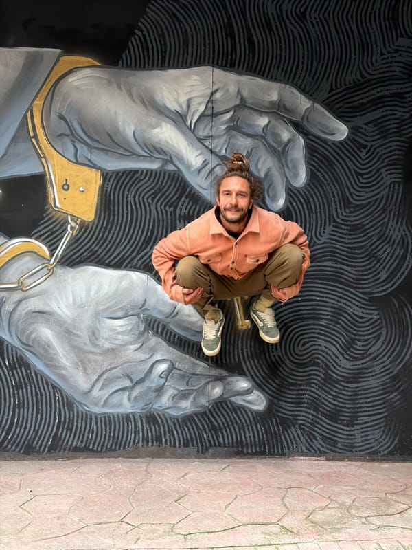 Man poses on street mural in Istanbul's Beyoğlu district