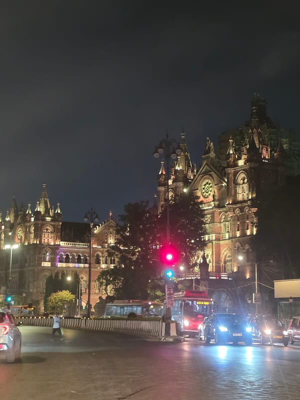 Mumbai's Historic Railway Terminal Illuminated During Evening Hours