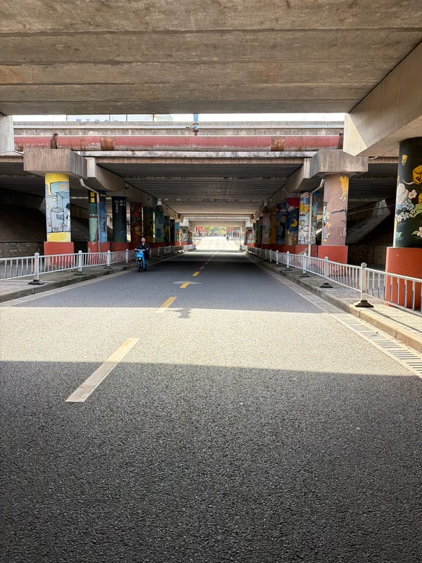 Roadway observed between concrete structures in Jiangning District