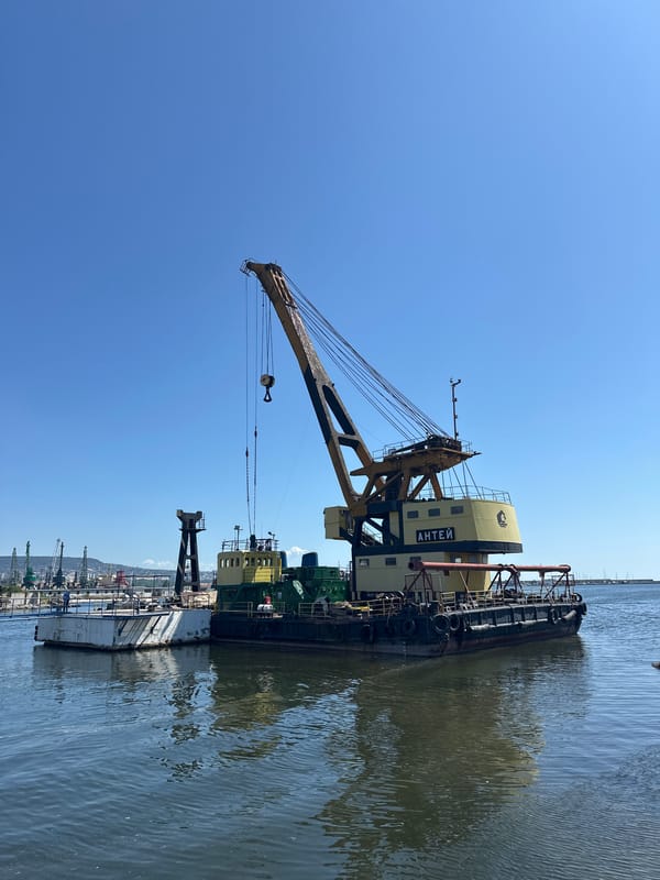 Crane barge АНТЕЙ at work in an industrial harbor