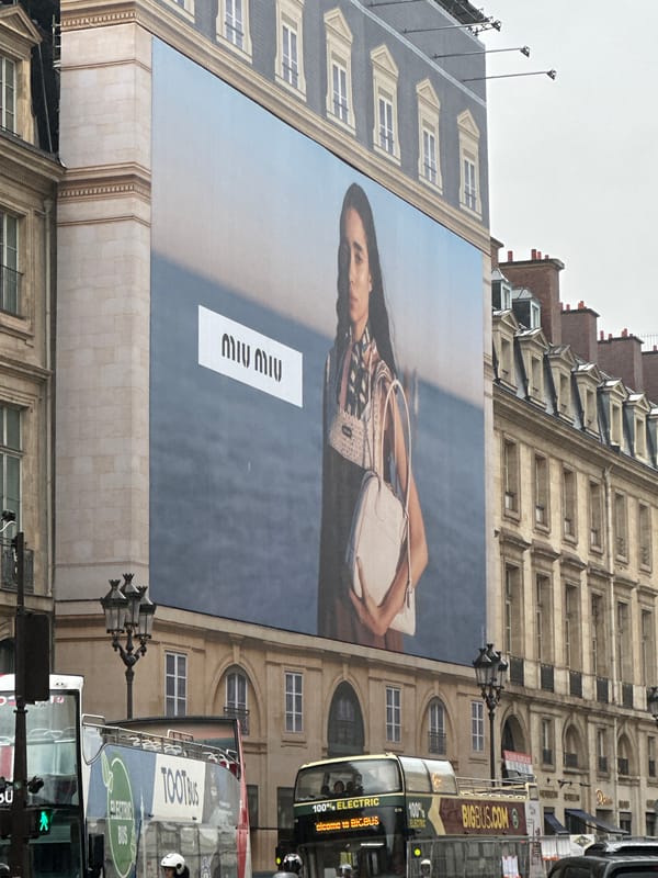 Rainy day street life in Paris luxury shopping district
