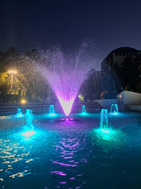 Colorful fountain light show in Popovo's town square