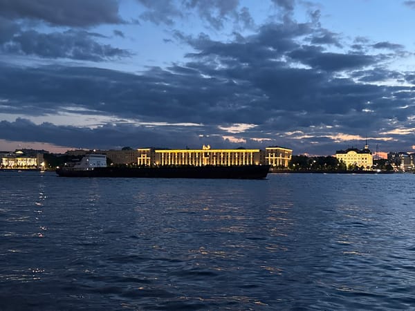 White Nights on the Neva: boats, embankments, and a glowing skyline