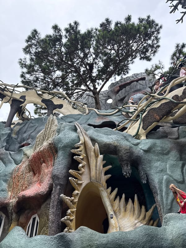 Tourist documents whimsical sculptures at Vietnam's Crazy House attraction