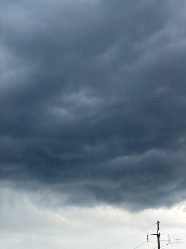 Storm clouds and indoor portraits captured in Chaikovsky, Russia