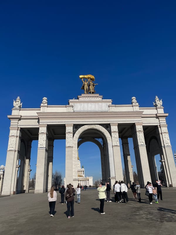 Women take selfie at monument in Khimki, Russia