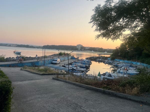 Primorsko harbor at golden hour, boats docked and calm