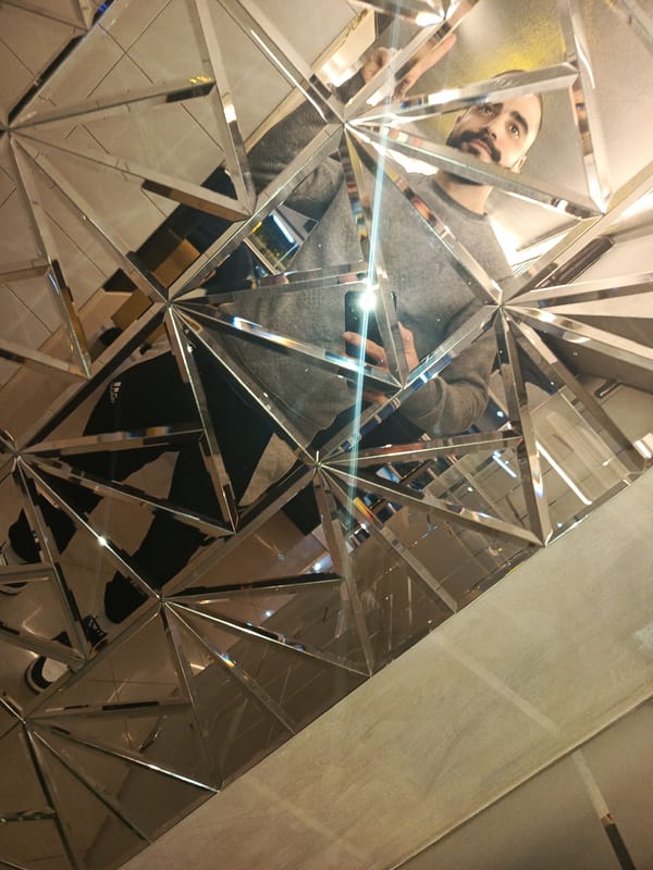 Man Takes Selfies at Geometric Mirror in Meknes