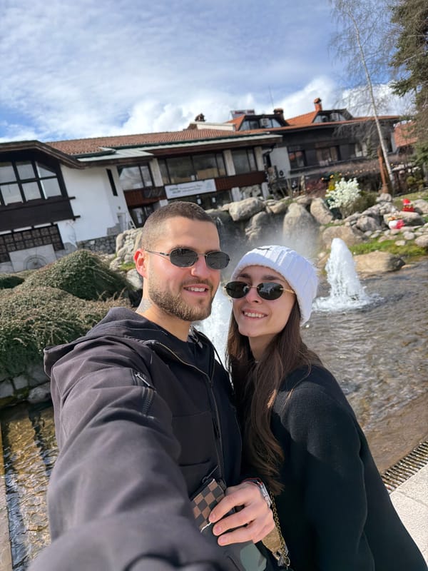Couple documents sightseeing tour through Bansko, Bulgaria attractions