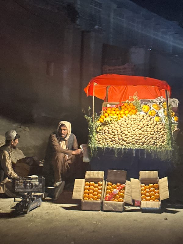 Fruit vendor operates street stall in Quetta City