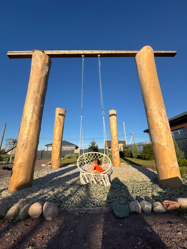 Garden afternoon in rural Russia: swings, dogs, and homegrown berries